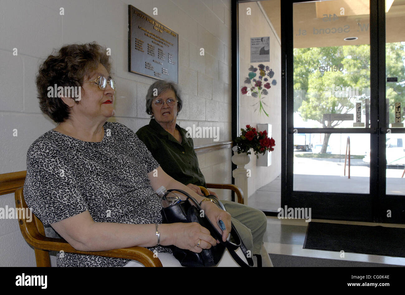 While waiting for the Dial-A-Ride bus to take them home, Angela Blanca, left, and Wanda Grady, both of Oakley, Calif., stay out of the oppressive heat and keep cool in the lobby at the Senior Center in Antioch, Calif., on Thursday, July 5, 2007. The Senior Center is an official Cooling Center. (Eddi Stock Photo