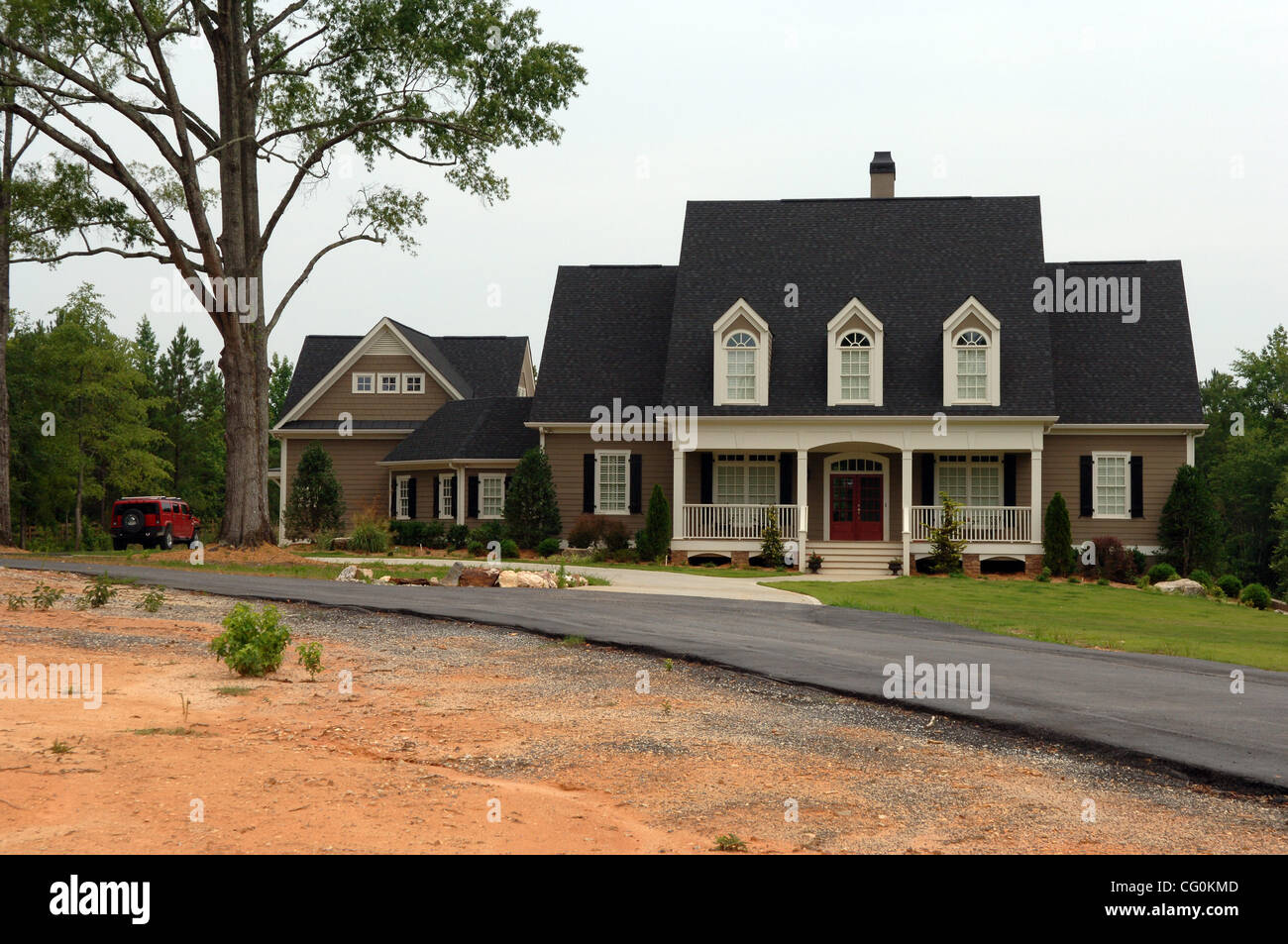Flowers and stuffed bear memorial on gate outside pro wrestler CHRIS