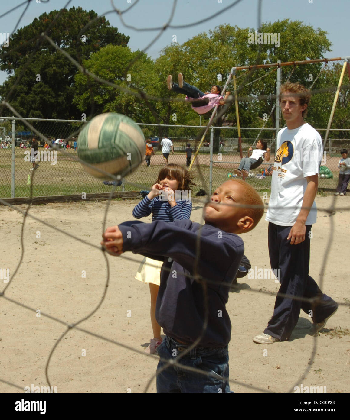 Brian Hunt of Oakland plays the net during a volley match at summer