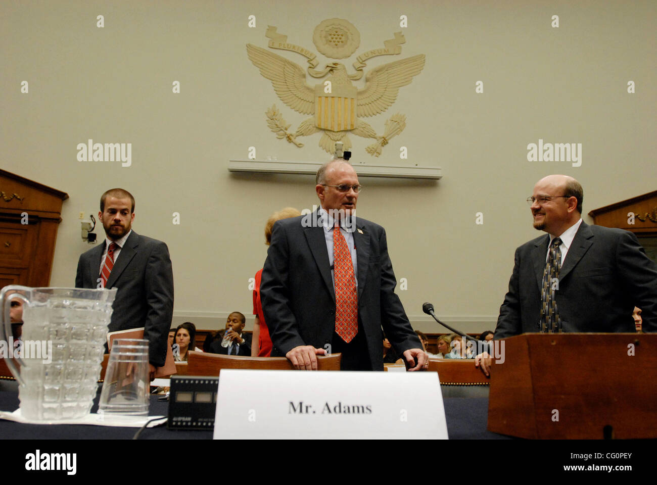 ROBERT ADAMS, Pardon Attorney for the Justice Department, prepares to testify before the House Judiciary committee during a hearing on the 'Use and Misuse of Presidential Clemency Power for Executive Branch Officials.' The hearing came about after President George Bush commuted former White House of Stock Photo