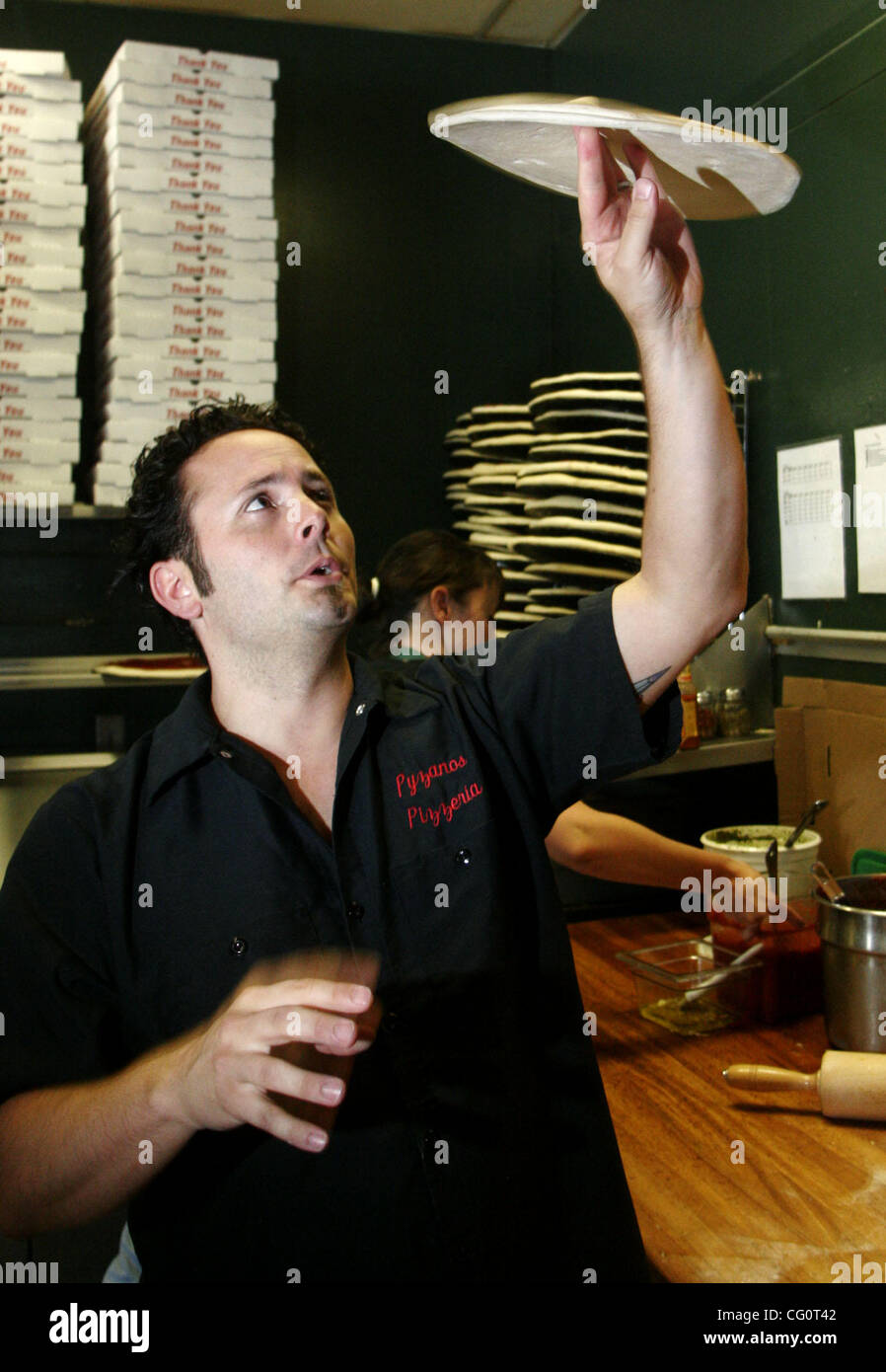 Tony Gemignani, recent winner of the World Pizza Cup pizza cooking contest in Naples, Italy, throwing dough at Pyzano's Pizza in Castro Valley, Calif. on Friday, July 13, 2007.  (Dean Coppola/Contra Costa Times) Stock Photo