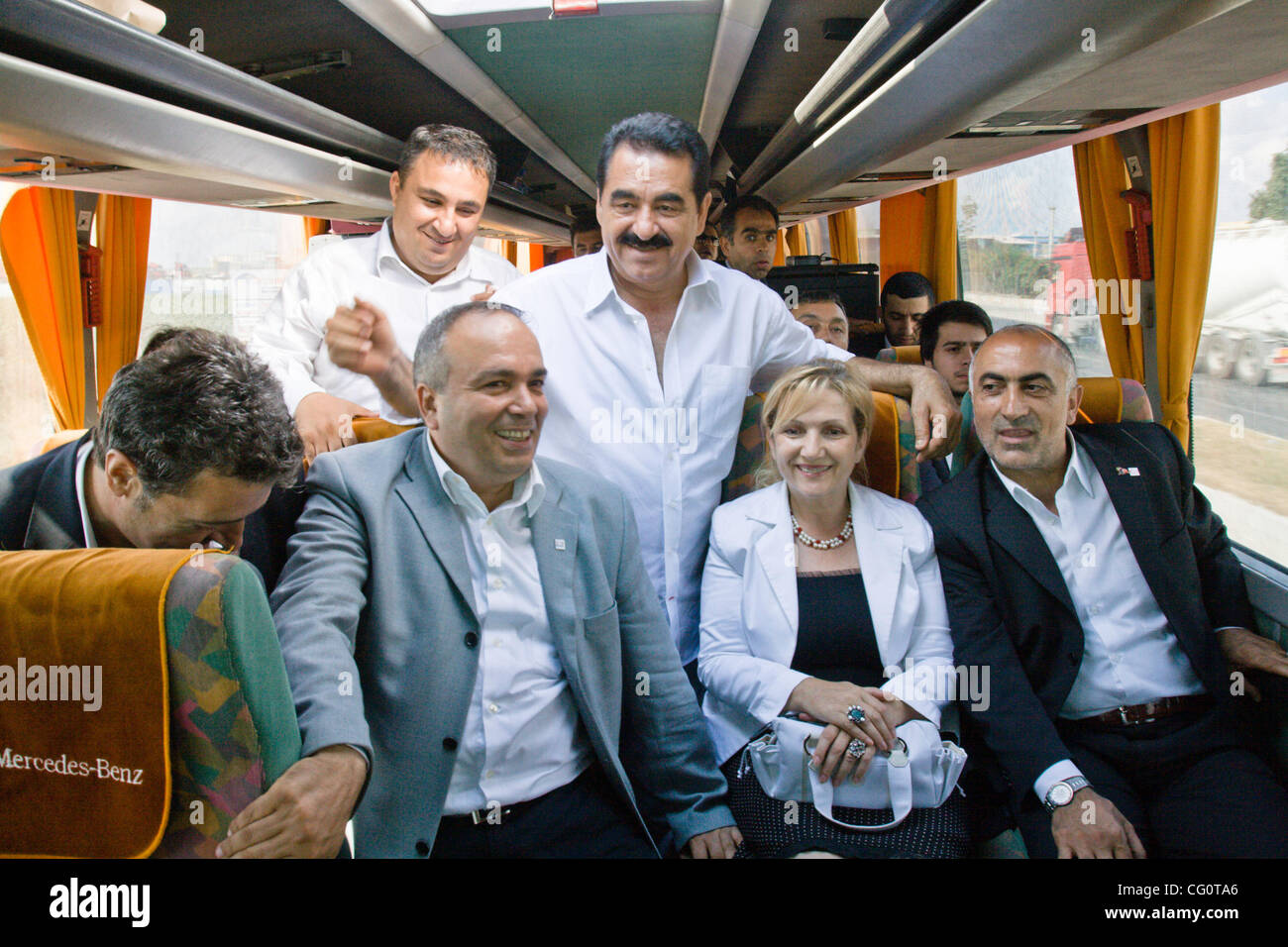 Ibrahim Tatlises (55), one of Turkey's most famous pop stars, makes a tour  through Istanbul on his campaign bus. He poses here with other candidates  on the Gench (Youth) party list (votes