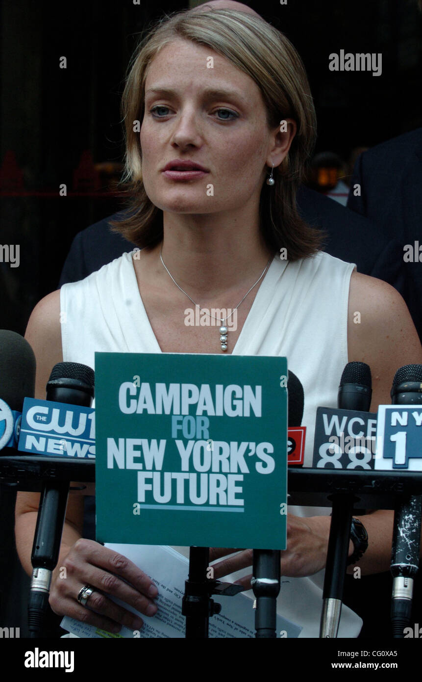 Neysa Pranger of the Straphangers Campaign speaks as leading members of