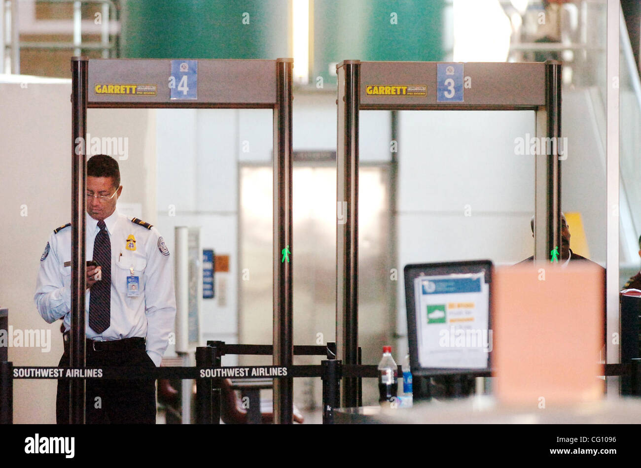 A TSA employee stands in an empty security screening inside terminal two of the Oakland Airport following an evacuation a man breached security in terminal two on Friday January 5, 2007 (Sean Connelley/The Oakland Tribune) Stock Photo