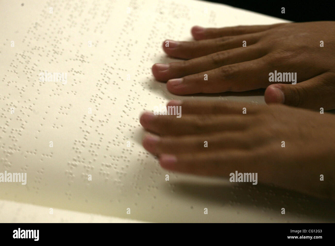 7/21/07 BOSTON, MA Marissa Parker reads the braille version of