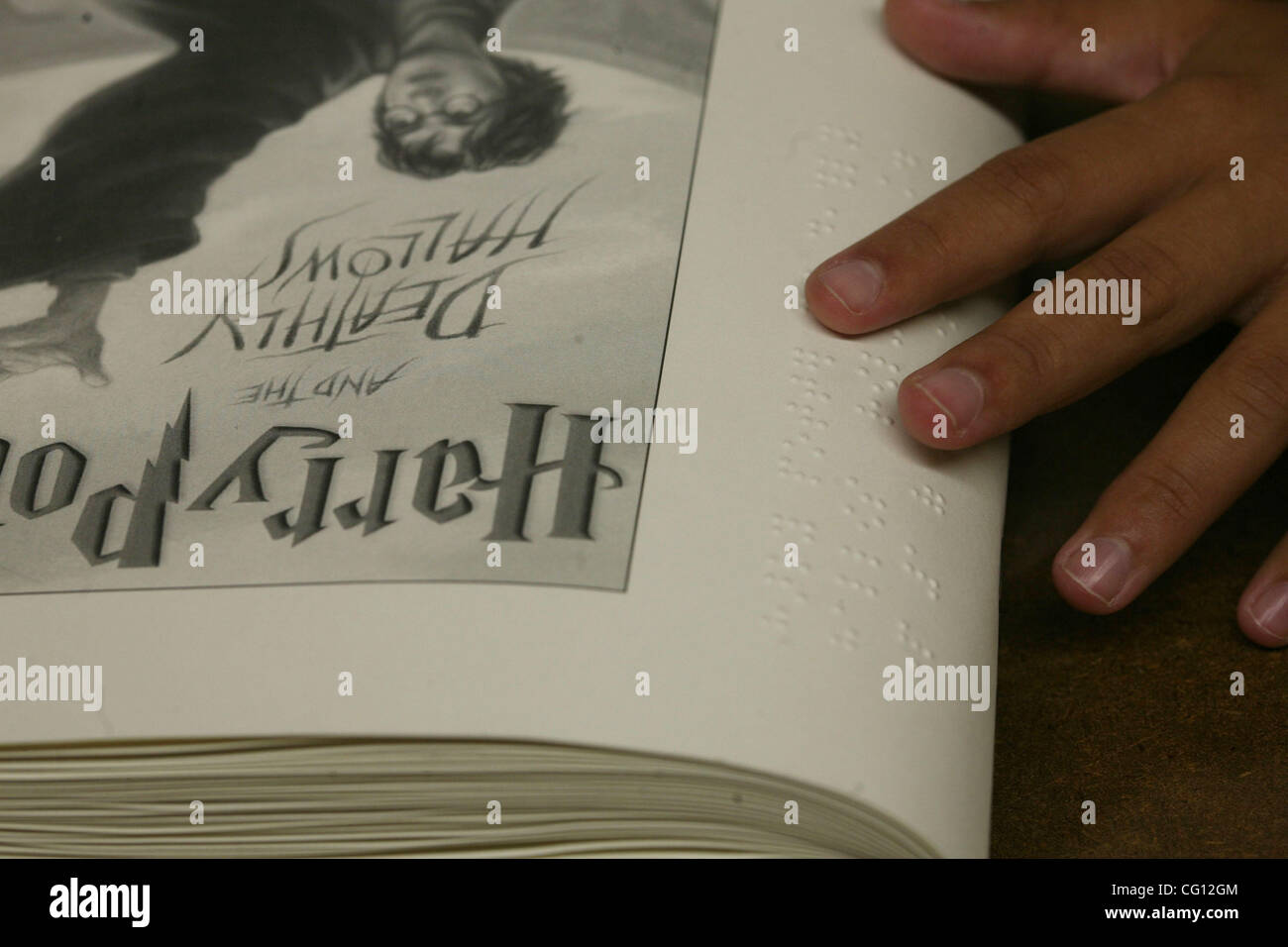 7/21/07 BOSTON, MA Marissa Parker reads the braille version of Harry