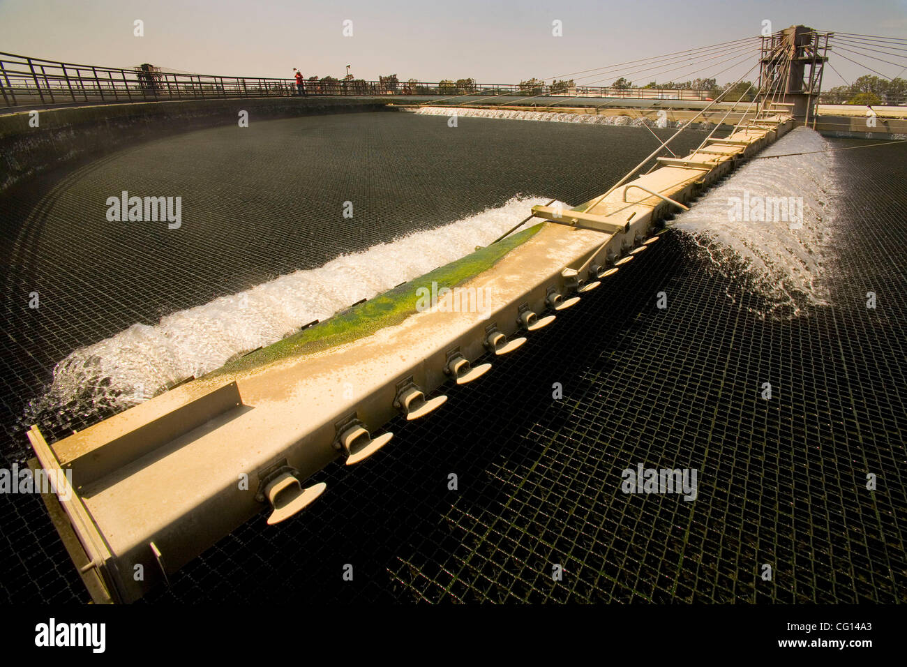 A rotarysweeping "trickling filter" skims lightweight solids from