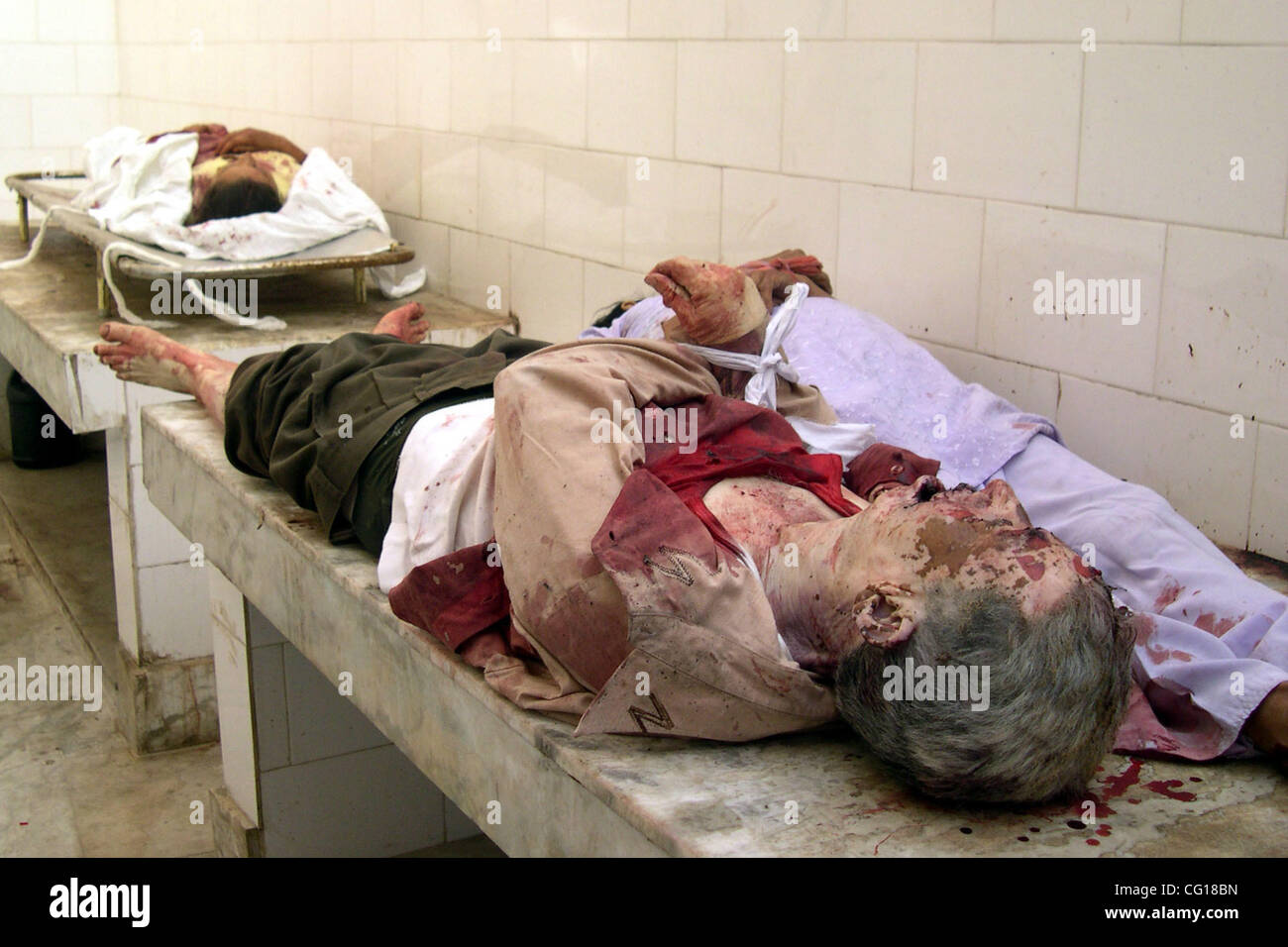 Dead Bodies of Tourists Lie In Police control room after a grenade explosion in Srinagar, India, Sunday, July 29, 2007. An explosion inside a bus carrying tourists killed at least 4 and wounded 21 others outside popular Shalimar Garden, police said. PHOTO/ALTAF ZARGAR. Stock Photo
