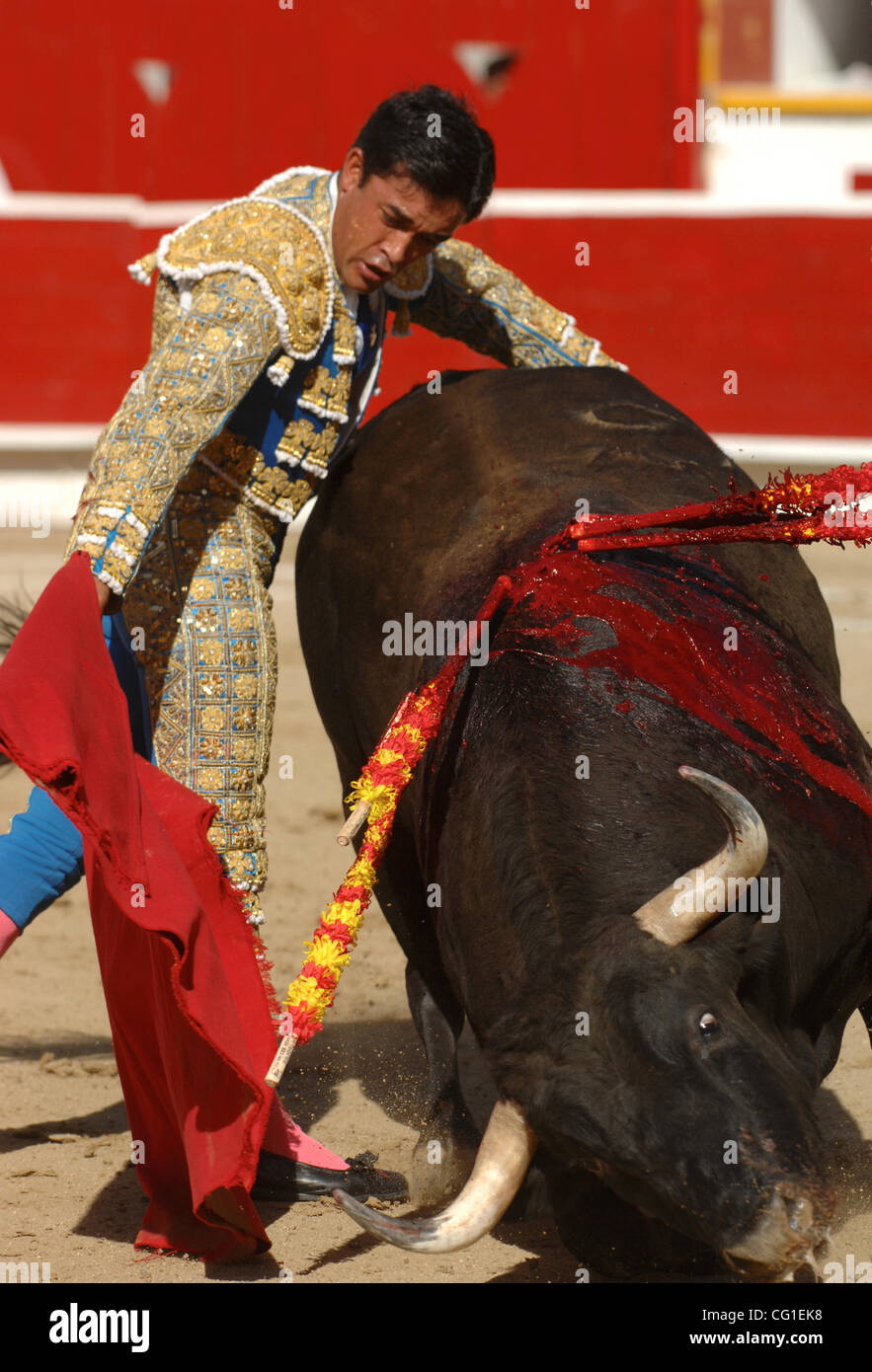 Bullfighter Rafael Ortega challenges the bull Universario at the