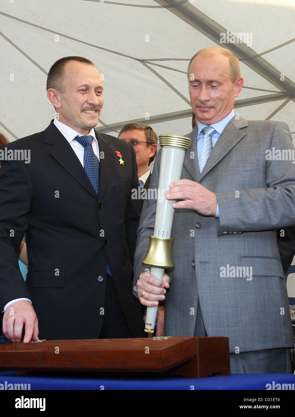 Vladimir Putin Visiting The Klimov Aircraft Engine Factory in St.Petersburg. President Vladimir Putin holding the 1980 Olympic torch, presented to him on Saturday, August 11 during a visit to an aircraft engine factory in St. Petersburg. Stock Photo