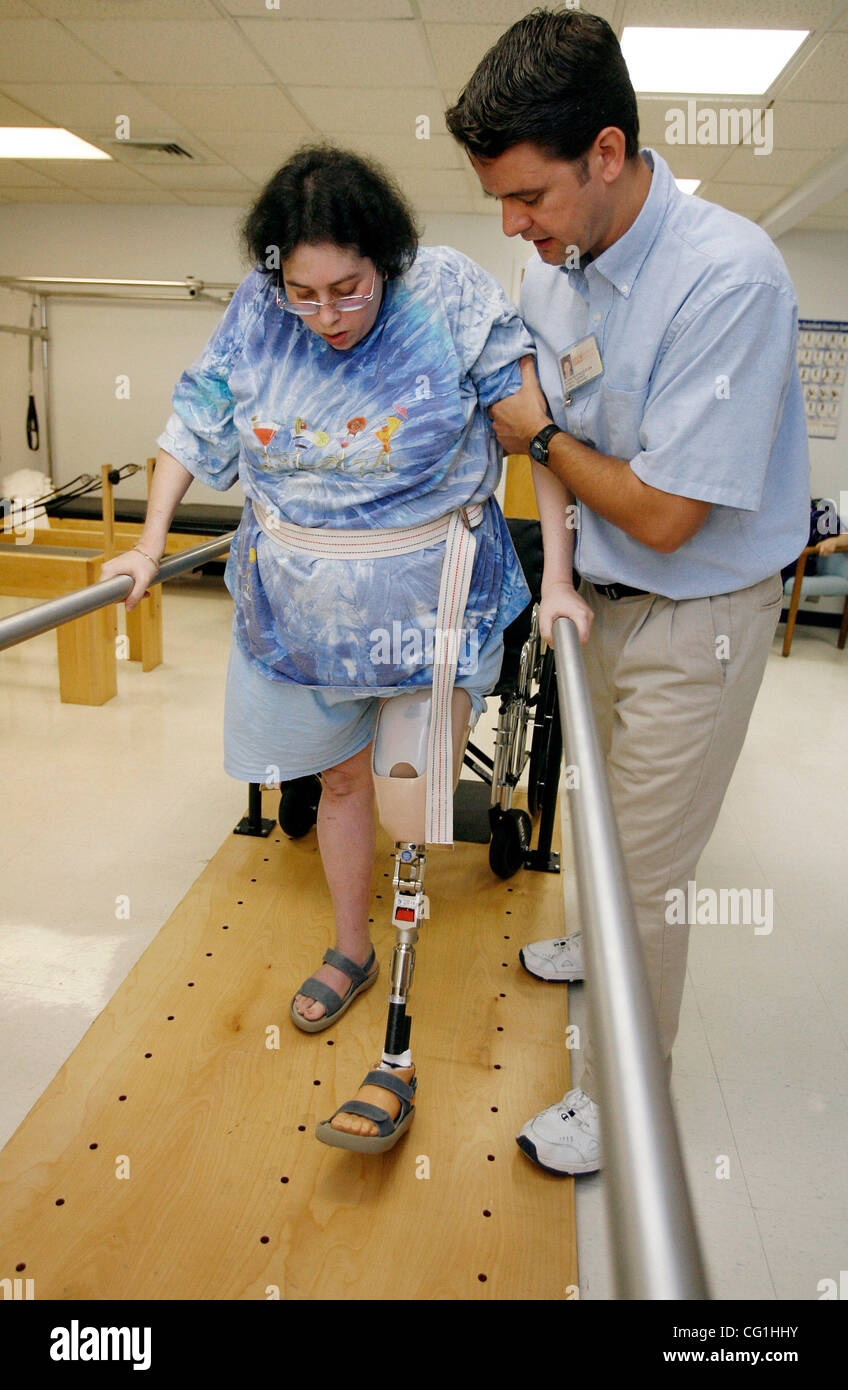 Aug 16, 2007 - Atlantis, FL, USA - Elissa Wehner walks on the parallel bars with the help of her physical therapist, Kenneth O' Sullivan.  Elissa Wehner goes to rehabilitative therapy at JFK hospital's outpatient facility on August 16, 2007.   (Credit Image: © J. Gwendolynne Berry/Palm Beach Post/ZU Stock Photo