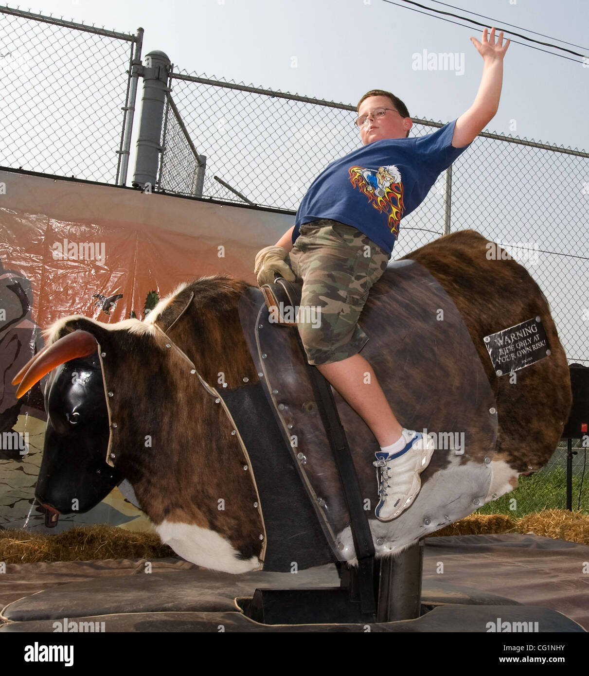 Aug 24, 2007 Des Moines, IA, USA A young man rides a mechanical