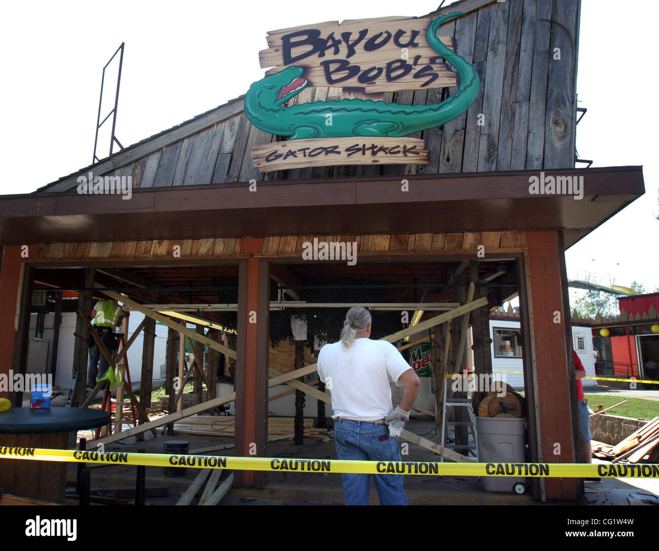 Dallas Simonette, owner of Bayou Bob's, talked on the phone as she ...