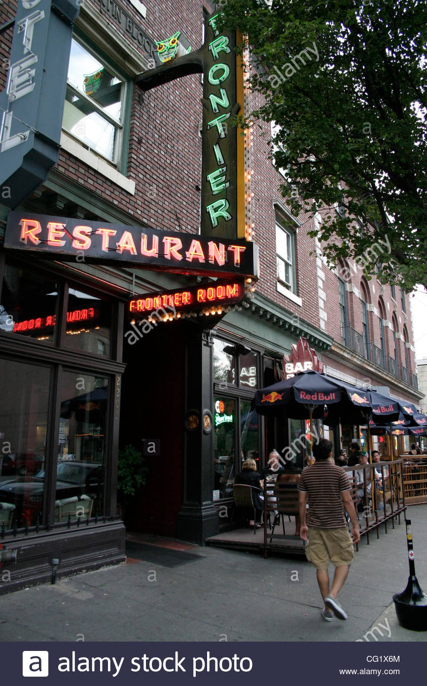 Century Old Red Brick Buildings Vintage Neon And Sidewalk