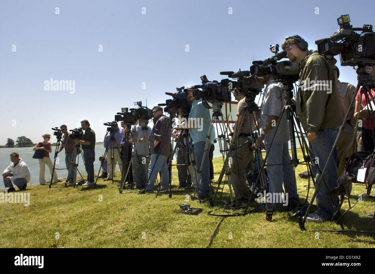 Media line the grass at the U.S. Coast Guard Station in Rio Vista for a press conference to hear the latest plans to encourage the pair of humpback whales back to sea Monday.The Sacramento Bee/  Anne Chadwick Williams/  May 21, 2007 Stock Photo