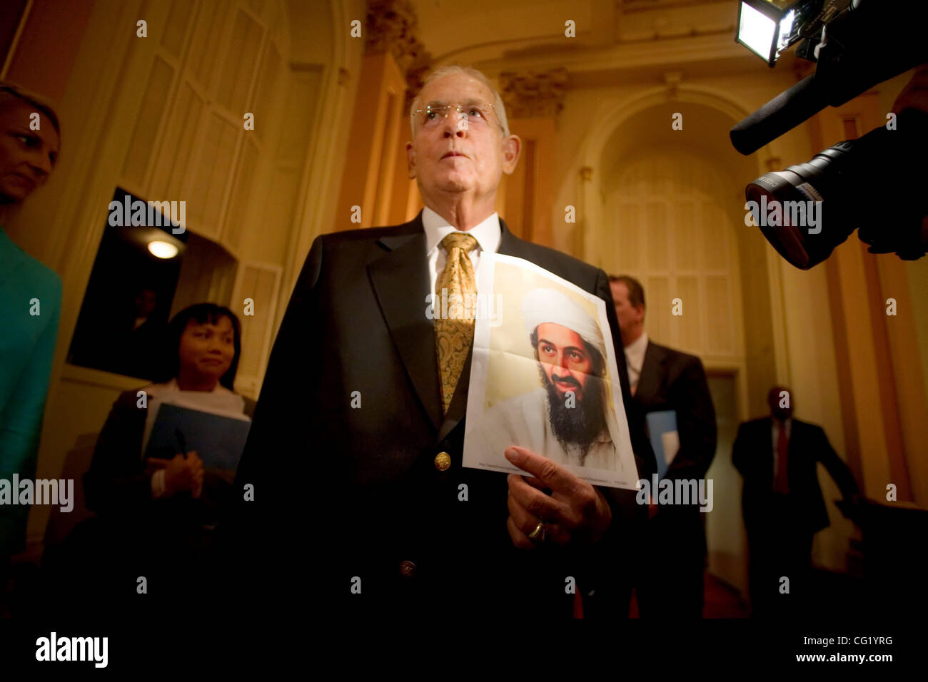 Senator Dave Cox, R-Fair Oaks, holds up a photo of a Bin Laden, as he reminds his democratic counterparts in the Senate what a real terrorist looks like, after the Senate adjourned Wednesday July 25, 2006, without passing a budget.  Sacramento Bee/ Brian Baer Stock Photo