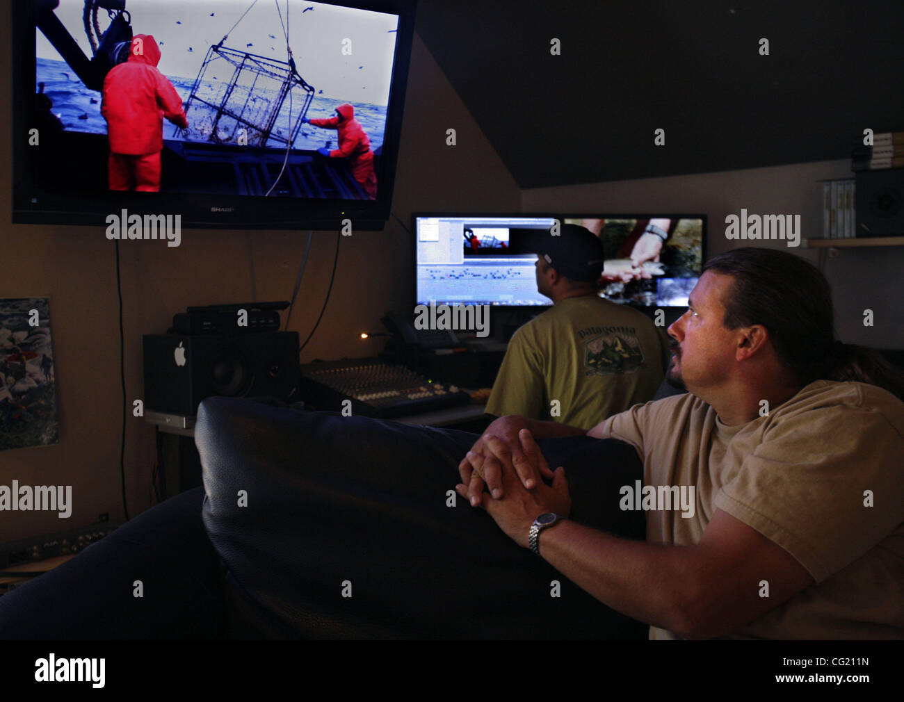 JUMP LEDE Foreground, Doug and Todd Stanley, behind, look through some