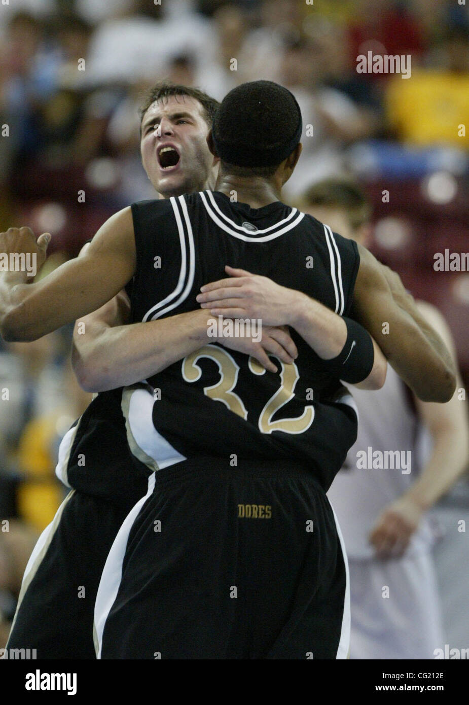 32 for Vanderbilt Shan Foster gets hugged by teammate #20 Dan Cage after  foster hit a three to put into overtime. During the Men's Basketball  Tournament at Arco Arena, Sacramento, Calif. Saturday,