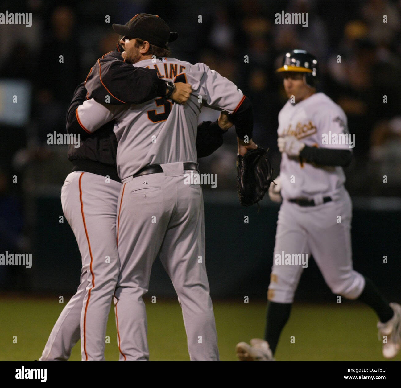 Is held back as he goes for the ball hires stock photography and