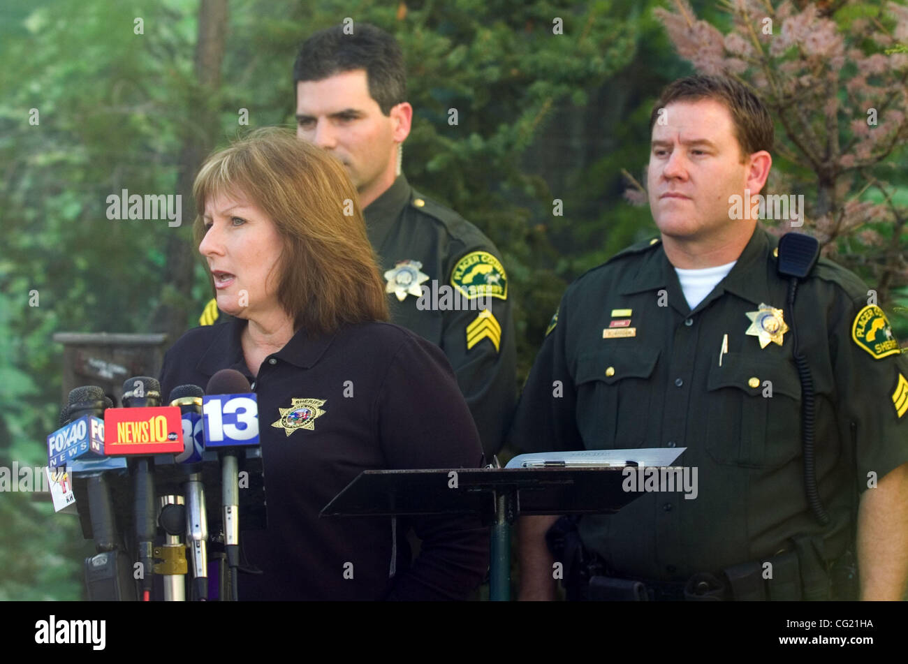 Placer County Sheriff public information officer Dena Erwin, left, briefs the media about the circumstances surrounding the arrest of Sacramento King Ron Artest Monday, March 5, 2007 in Auburn, Calif. Artest was arrested and charged with domestic violence and using force or violence to prevent his v Stock Photo