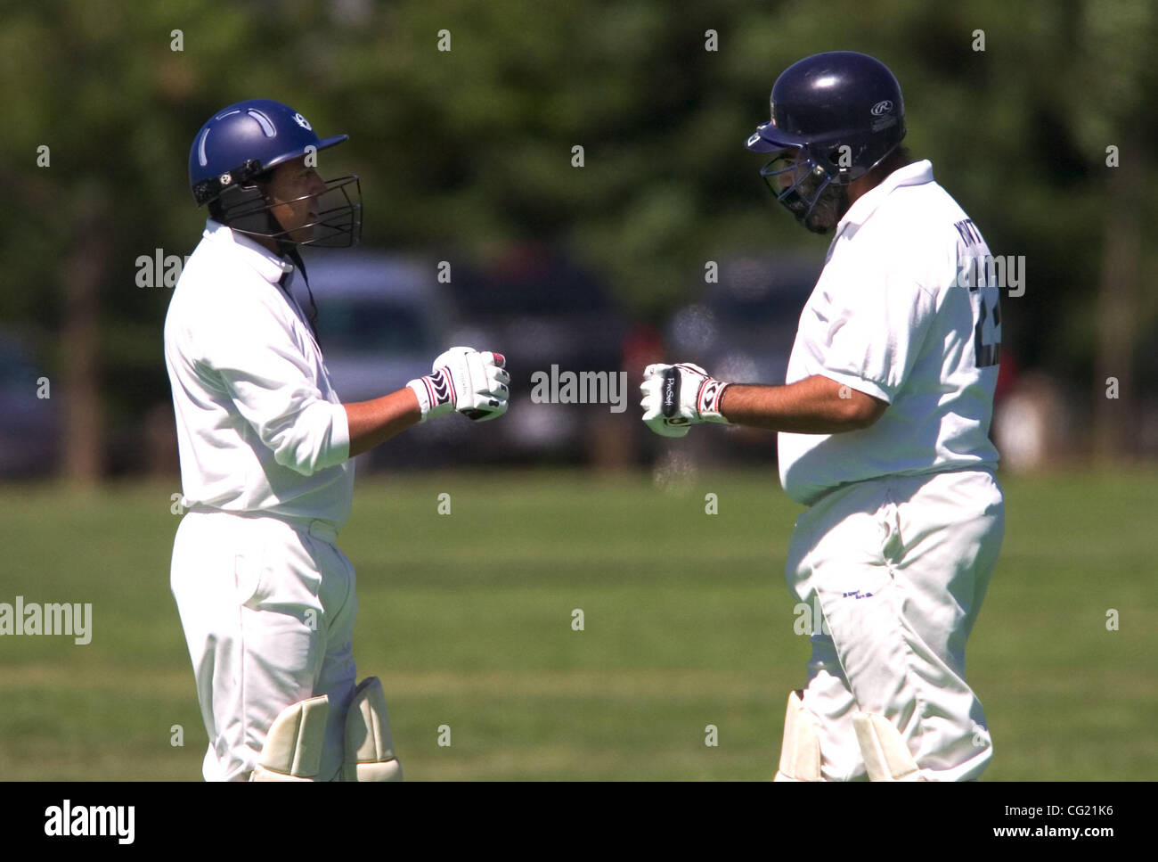 Roseville Cricket Club members Pavan Shah, (cq) left, and Monty Bhatia (cq) confer during a match against the Tiger Cricket Club (Sacramento) Saturday, June 16, 2007 at Miadu Park. Rosevile is trying to woo high tech workers with some of the comforts of home, like cricket --  a very popular sport am Stock Photo