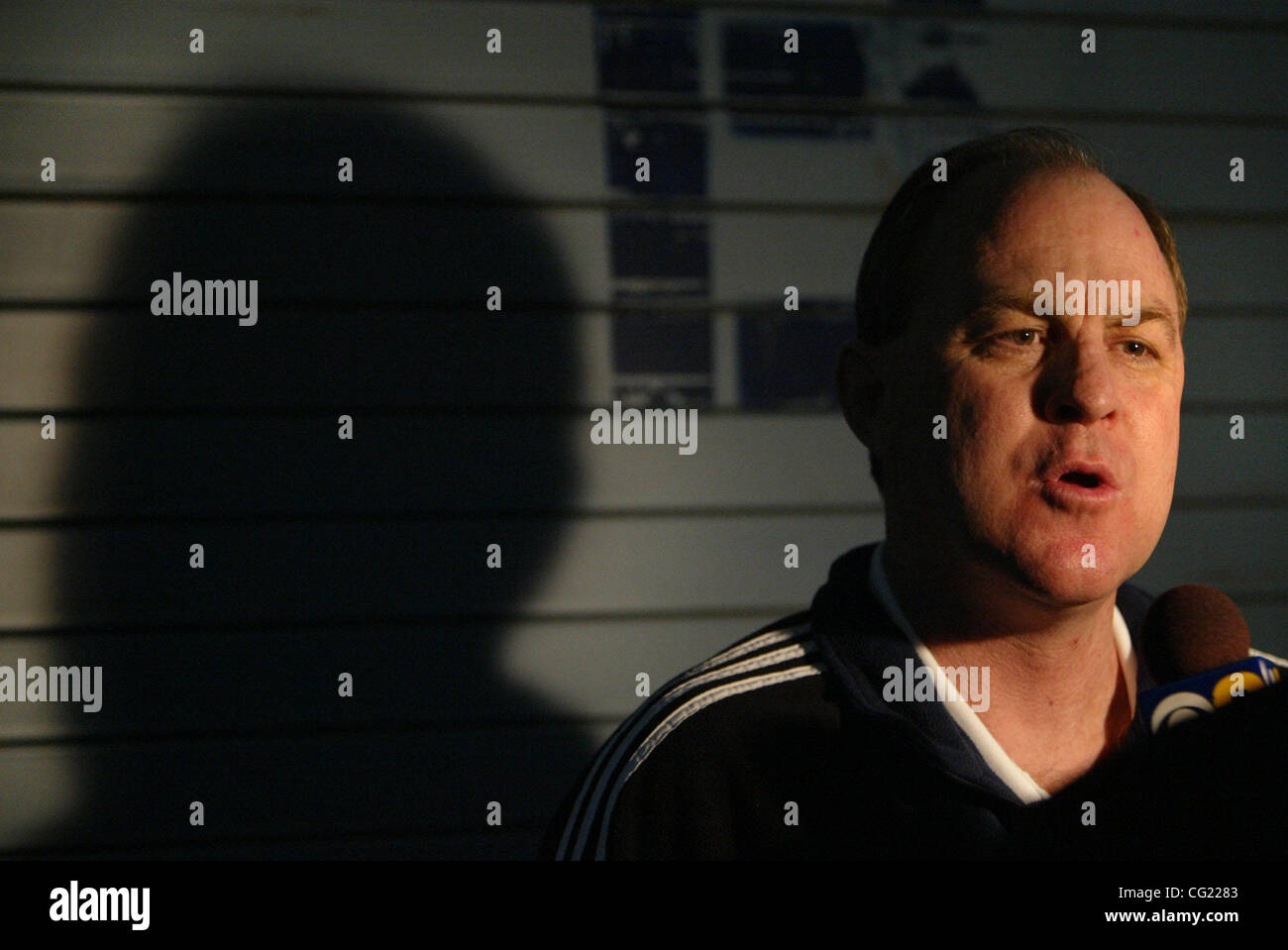 UCLA coach Ben Howland gets interviewed outside the UCLA lockeroom ...