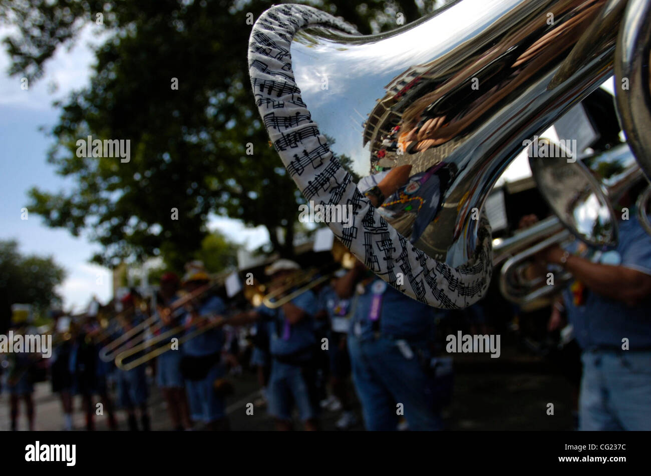 Jazz music lovers and musicians partake in the opening day parade of