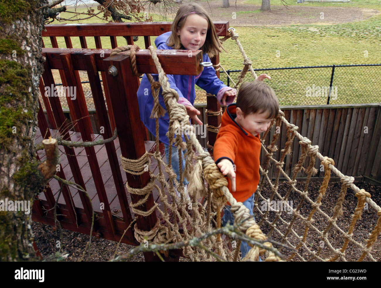 Jeremy Sanders not only built a playground, but also a rope bridge for his  kids Jamie Sanders (cq, left), 6, and Coltin Sanders (cq, right), 5, in his  backyard in Roseville, February