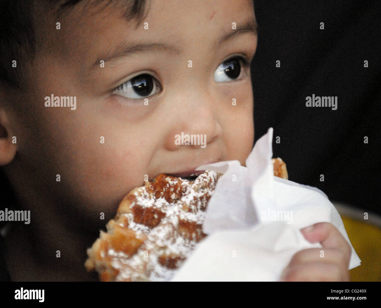 Joshua Maestre (cq), 2, chomps on a belgian waffle from Red Rooster