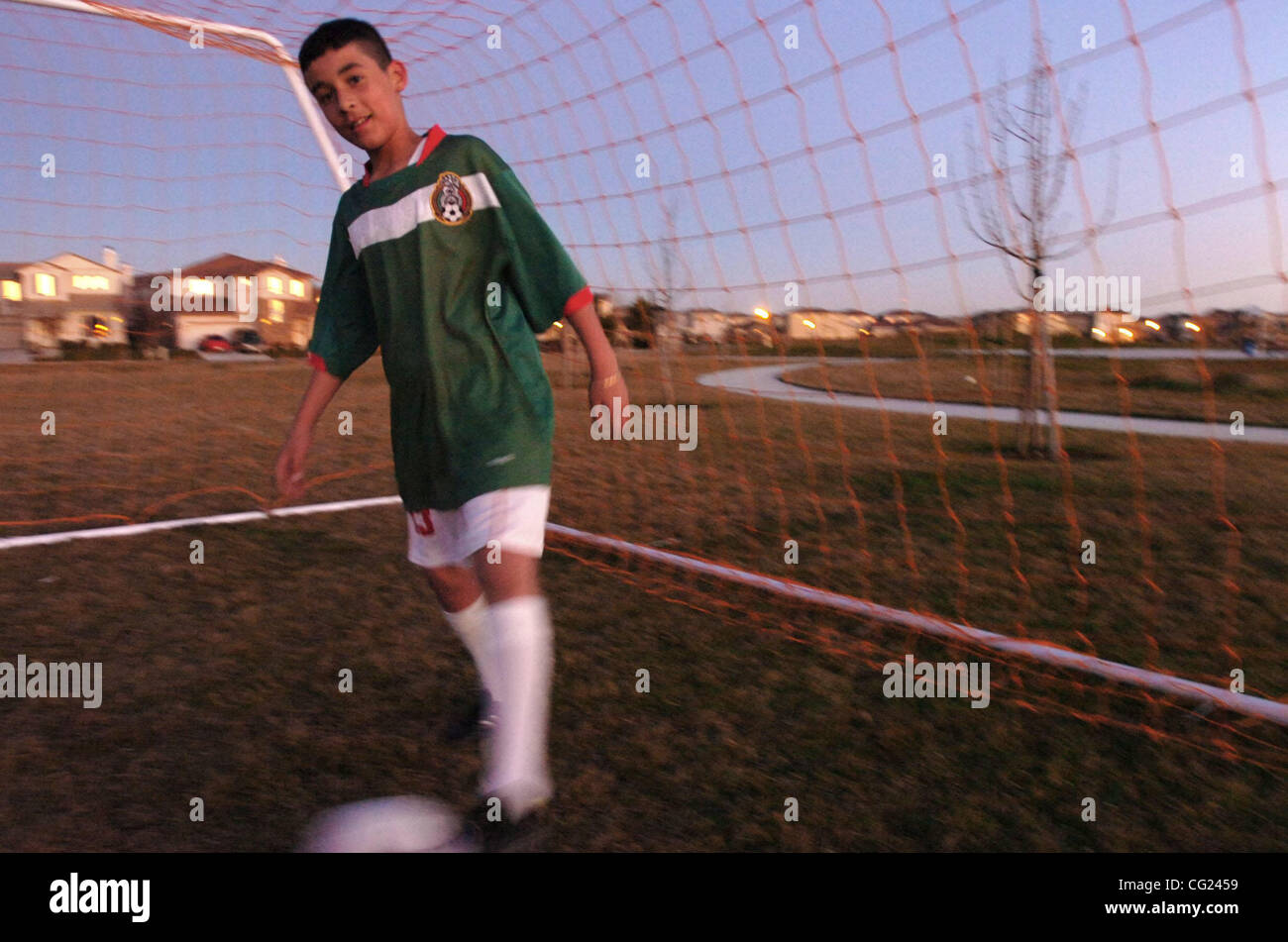Daniel Cisneros, 12, of Natomas, practices goal keeping at Burberry Community Park in Natomas on Thursday, January 11,  2007. Cisneros said that he doesn't like the lack of restrooms at the park. (  The Sacramento Bee Hector Amezcua ) Stock Photo