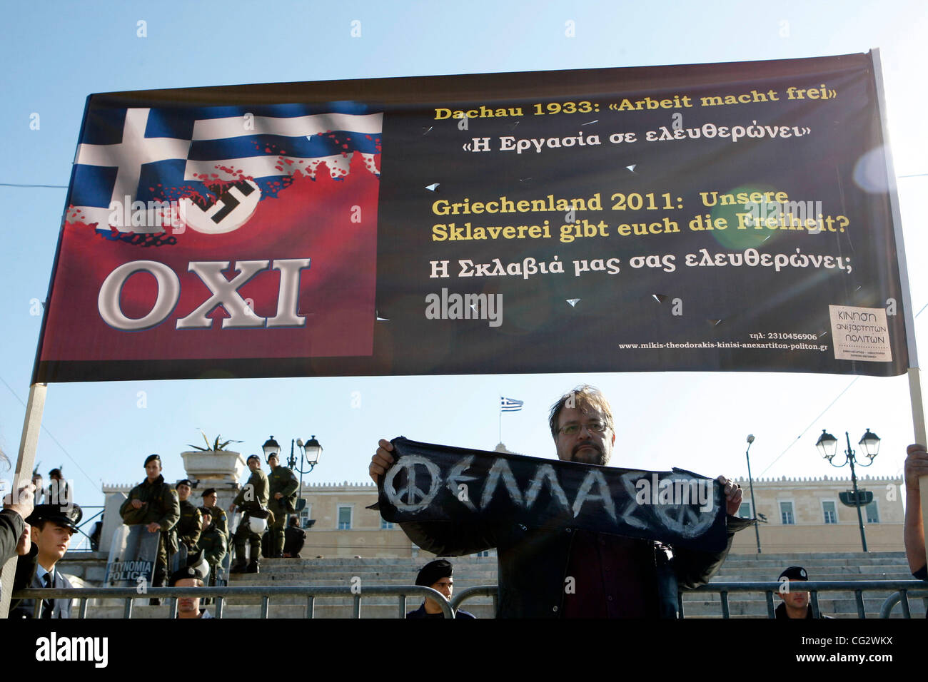 Oct. 28, 2011 - Athens, Greece - Protesters hold a banner with the Greek flag and swastika reading ''No to the 4th Reich''  during a student parade for the 71st anniversary of Greece's entry into World War II in front of Education Minister Anna Diamantopoulou outside  the Greek Parliament. (Credit I Stock Photo