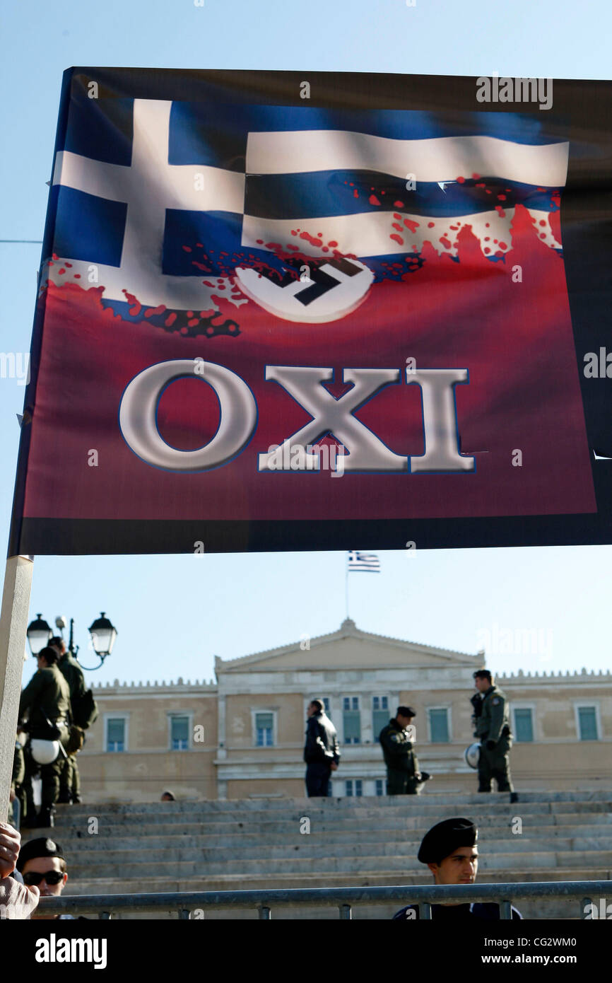 Oct. 28, 2011 - Athens, Greece - Protesters hold a banner with the Greek flag and swastika reading ''No to the 4th Reich''  during a student parade for the 71st anniversary of Greece's entry into World War II in front of Education Minister Anna Diamantopoulou outside  the Greek Parliament. (Credit I Stock Photo