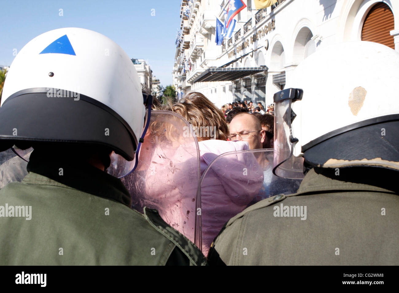 Oct. 28, 2011 - Athens, Greece - A protester holds his terrified child among the riot police. Protest during student parade for the 71st anniversary of Greece's entry into World War II in front of Education Minister Anna Diamantopoulou outside  the Greek Parliament. (Credit Image: © Aristidis Vafeia Stock Photo