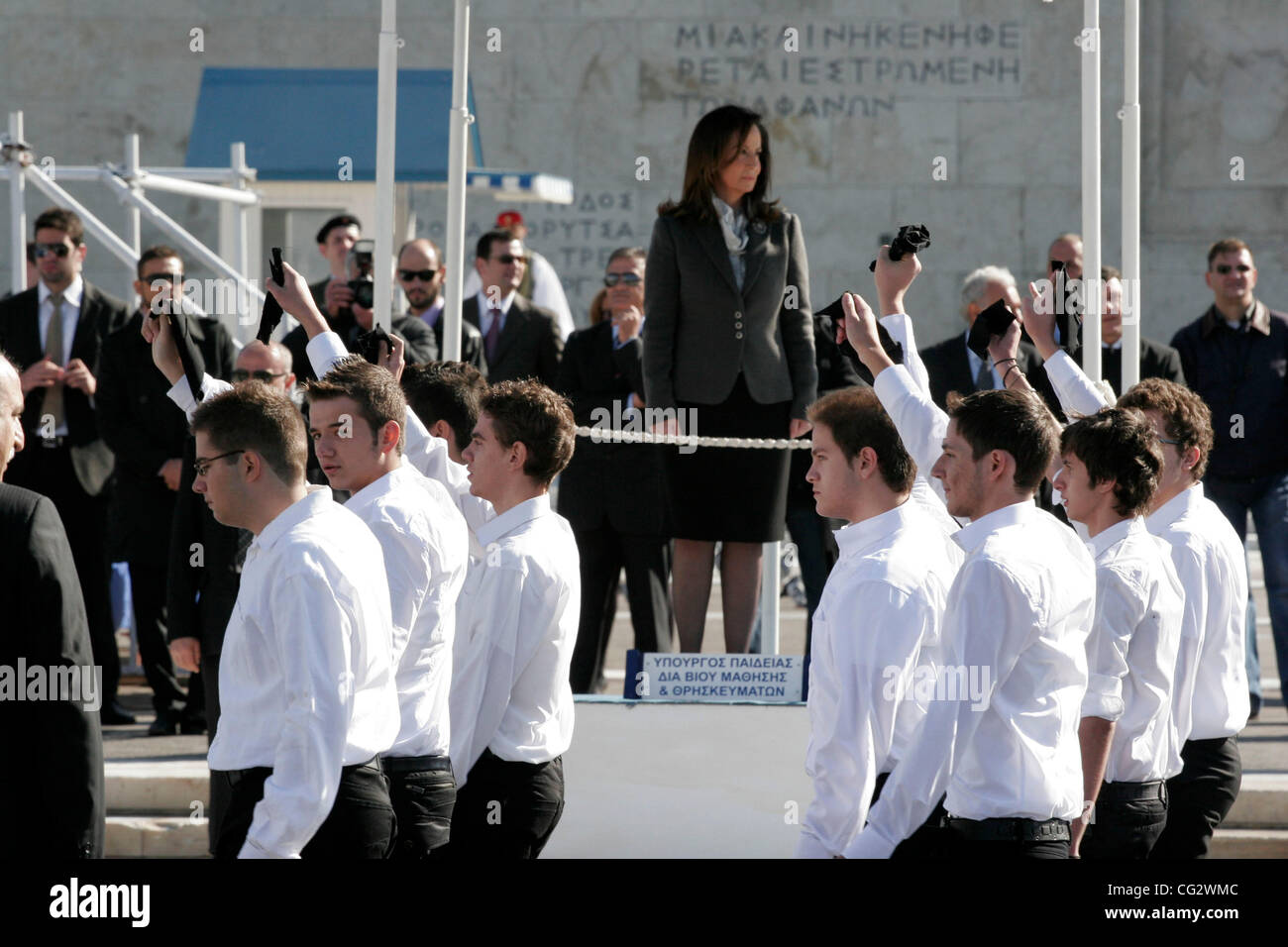 Oct. 28, 2011 - Athens, Greece - Students wave black handkerchiefs in protest as they pass in front of Education Minister Anna Diamantopoulou during a parade for the 71st anniversary of Greece's entry into World War II. (Credit Image: © Aristidis Vafeiadakis/ZUMAPRESS.com) Stock Photo