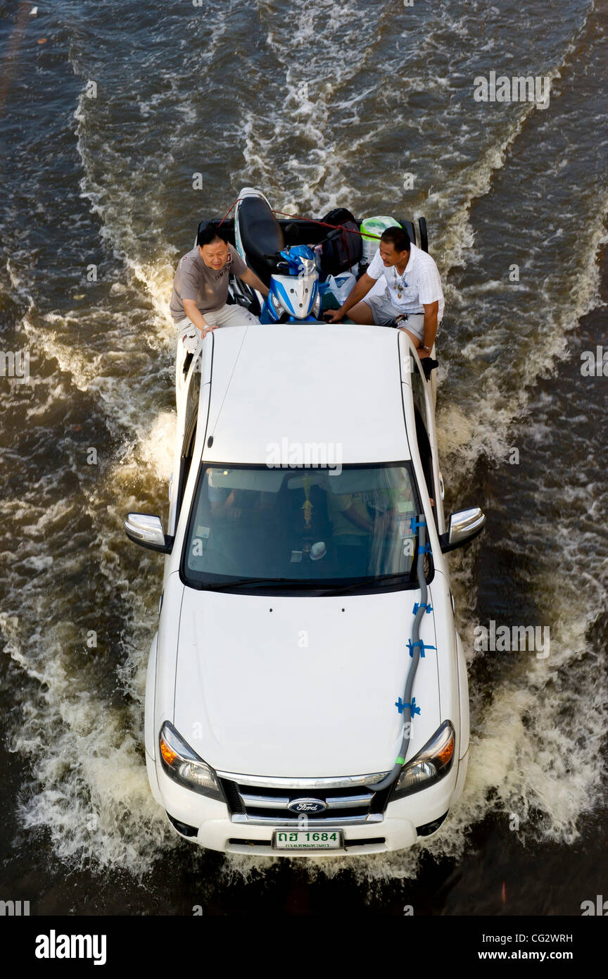 Oct. 29, 2011 - Bangkok, Thailand - A pickup truck drives along a flooded street as floodwaters creep further into the capitol's center. Thailand is suffering from it's worst flooding in 50 years. Around 380 people have died since late July according to Department of Disaster Prevention and Mitigati Stock Photo