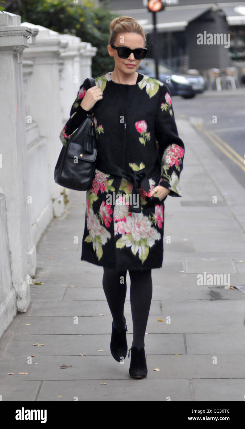 Kylie Minogue leaving her house wearing a floral print coat and sunglasses.  London, England - 13.12.10 Stock Photo - Alamy