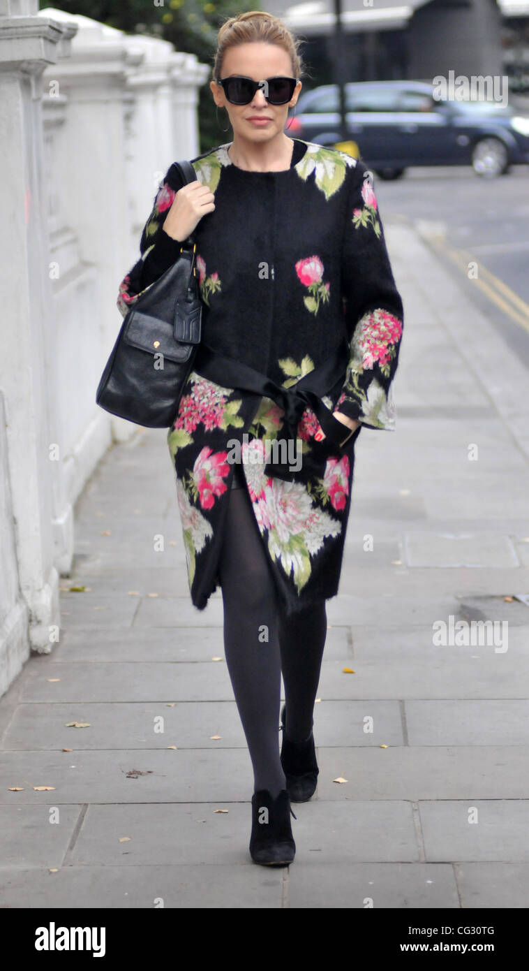 Kylie Minogue leaving her house wearing a floral print coat and sunglasses.  London, England - 13.12.10 Stock Photo - Alamy