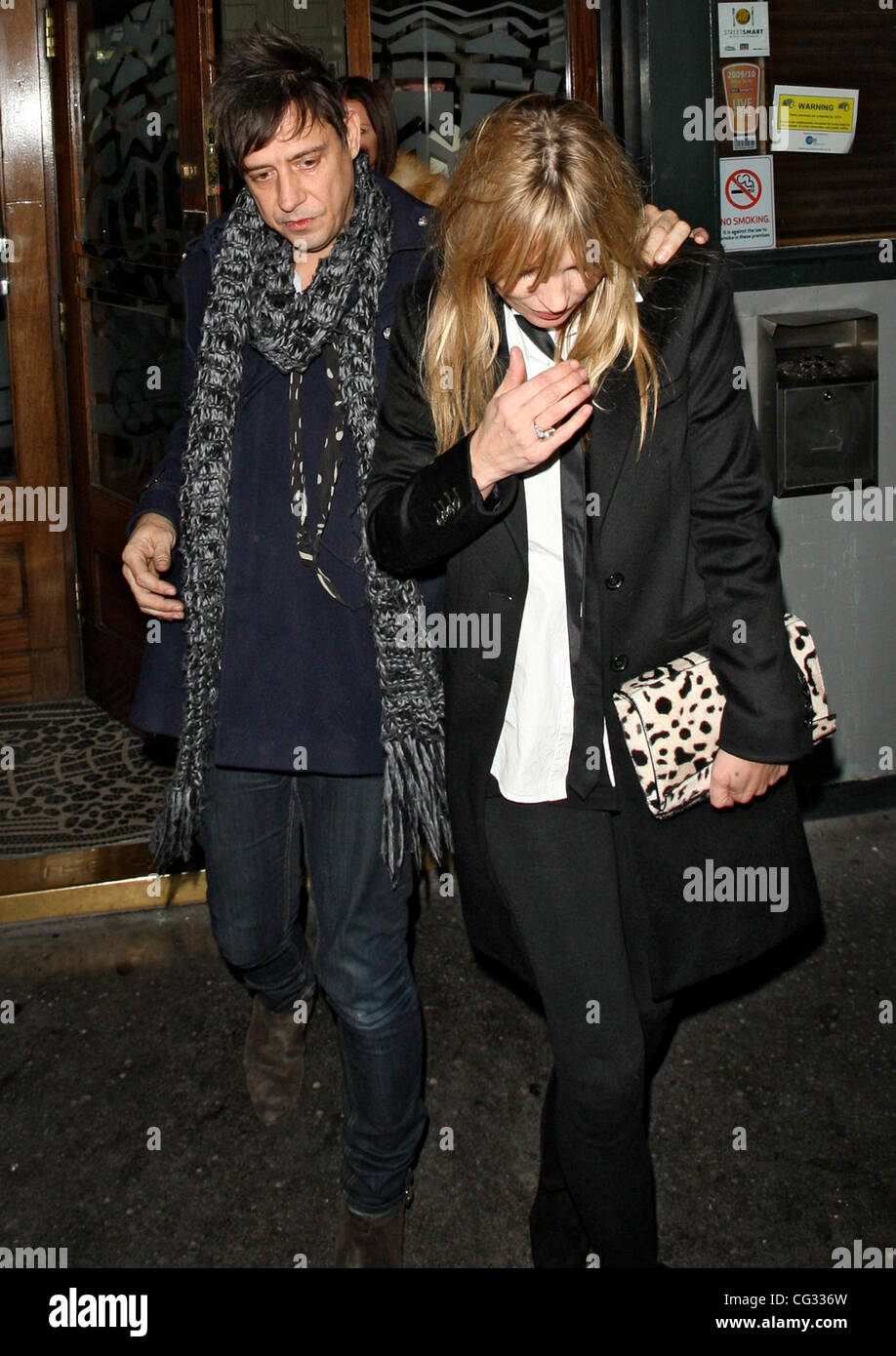 Kate Moss and Jamie Hince leaving Groucho Club at 3am, Kate arrived at 9.45pm and met Jamie inside. London, England - 14.12.10 Stock Photo