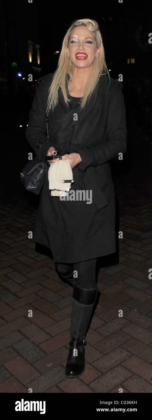Sarah Harding leaving the Capital FM studios in Leicester Square, having guest presented the drivetime show with her friend Greg Burns. The pair were picked up in Sarah's car, and whisked into the night. Sarah had been due on the show at 4pm, but the bad Stock Photo