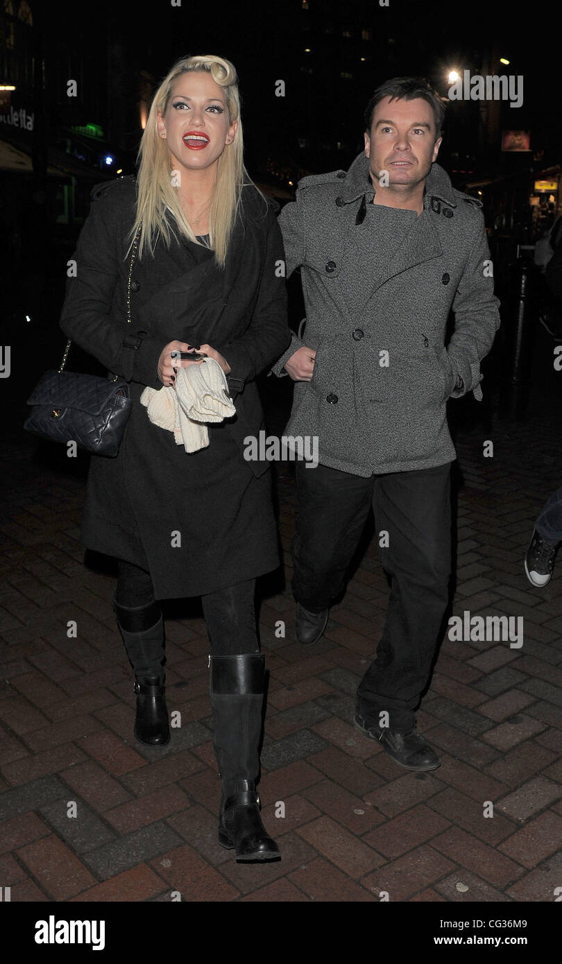 Sarah Harding leaving the Capital FM studios in Leicester Square, having guest presented the drivetime show with her friend Greg Burns. The pair were picked up in Sarah's car, and whisked into the night. Sarah had been due on the show at 4pm, but the bad Stock Photo