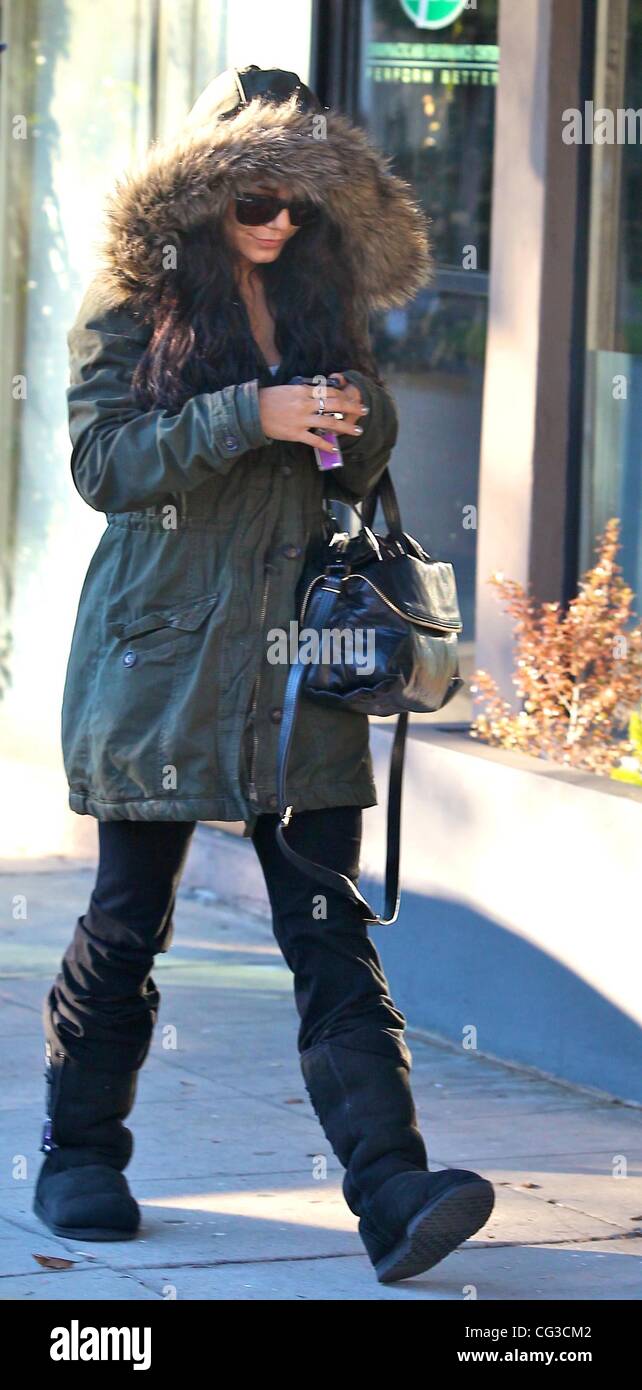 Vanessa Hudgens wrapped up for the cold in a fur rimmed coat and Ugg boots,  heads to the Chiropractic and Performance Center Los Angeles, California -  04.01.11 Stock Photo - Alamy