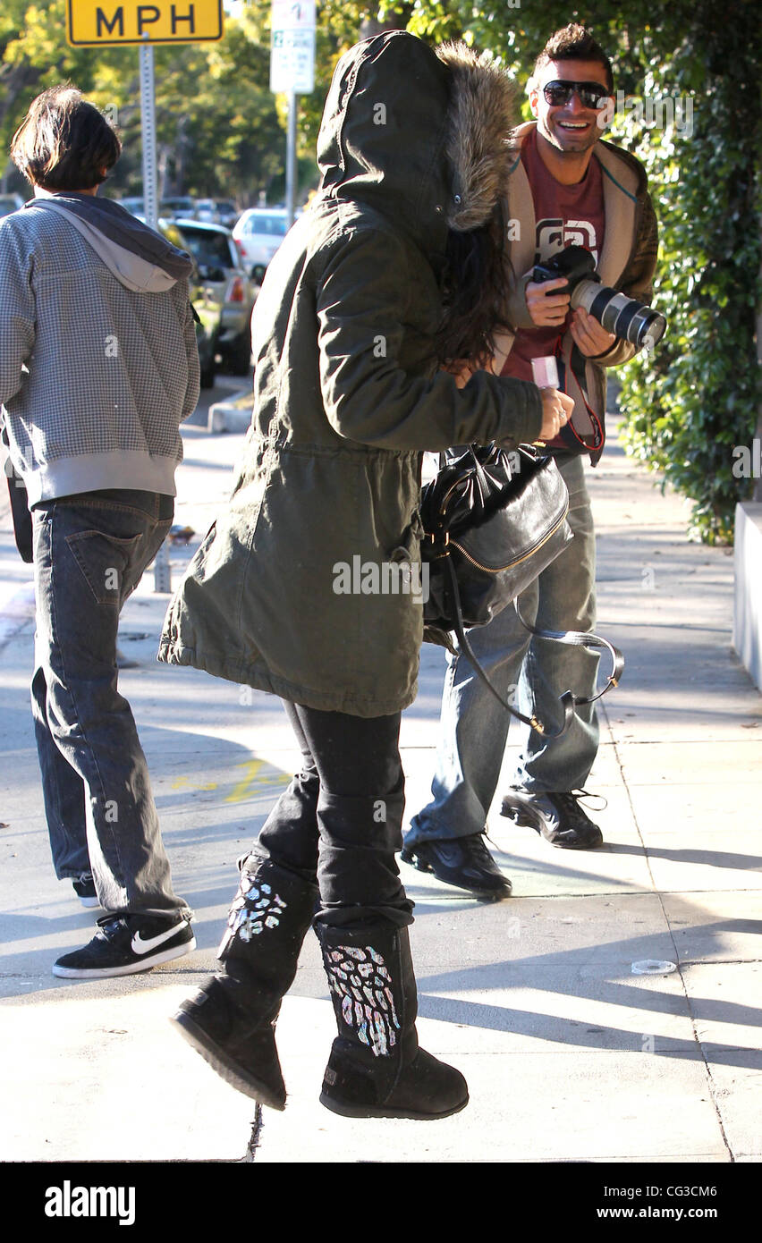 Vanessa Hudgens wrapped up for the cold in a fur rimmed coat and Ugg boots,  heads to the Chiropractic and Performance Center Los Angeles, California -  04.01.11 Stock Photo - Alamy