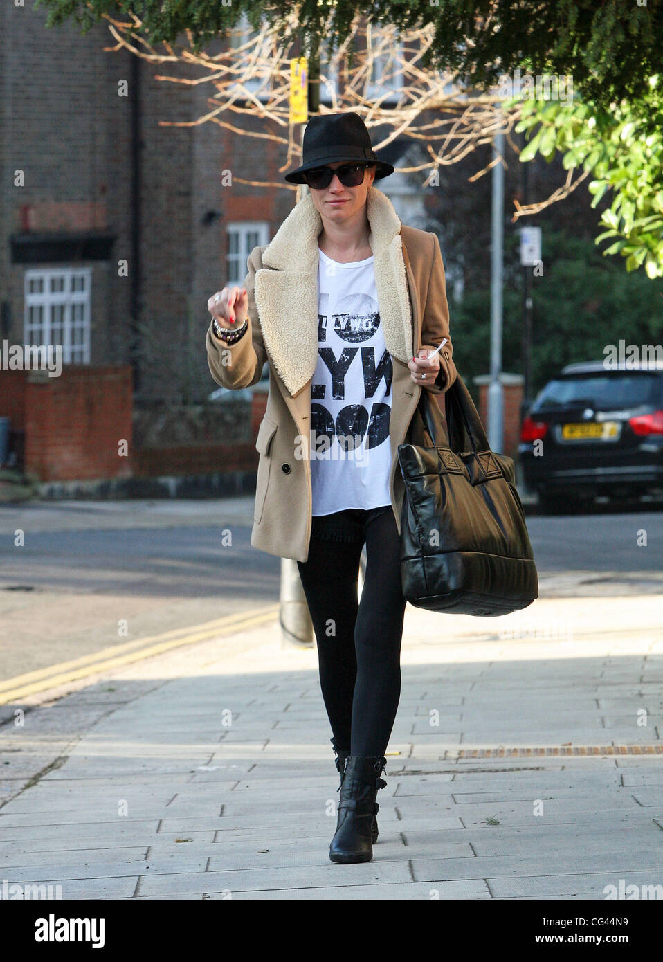 Denise Van Outen leaving home to go to a photoshoot London, England
