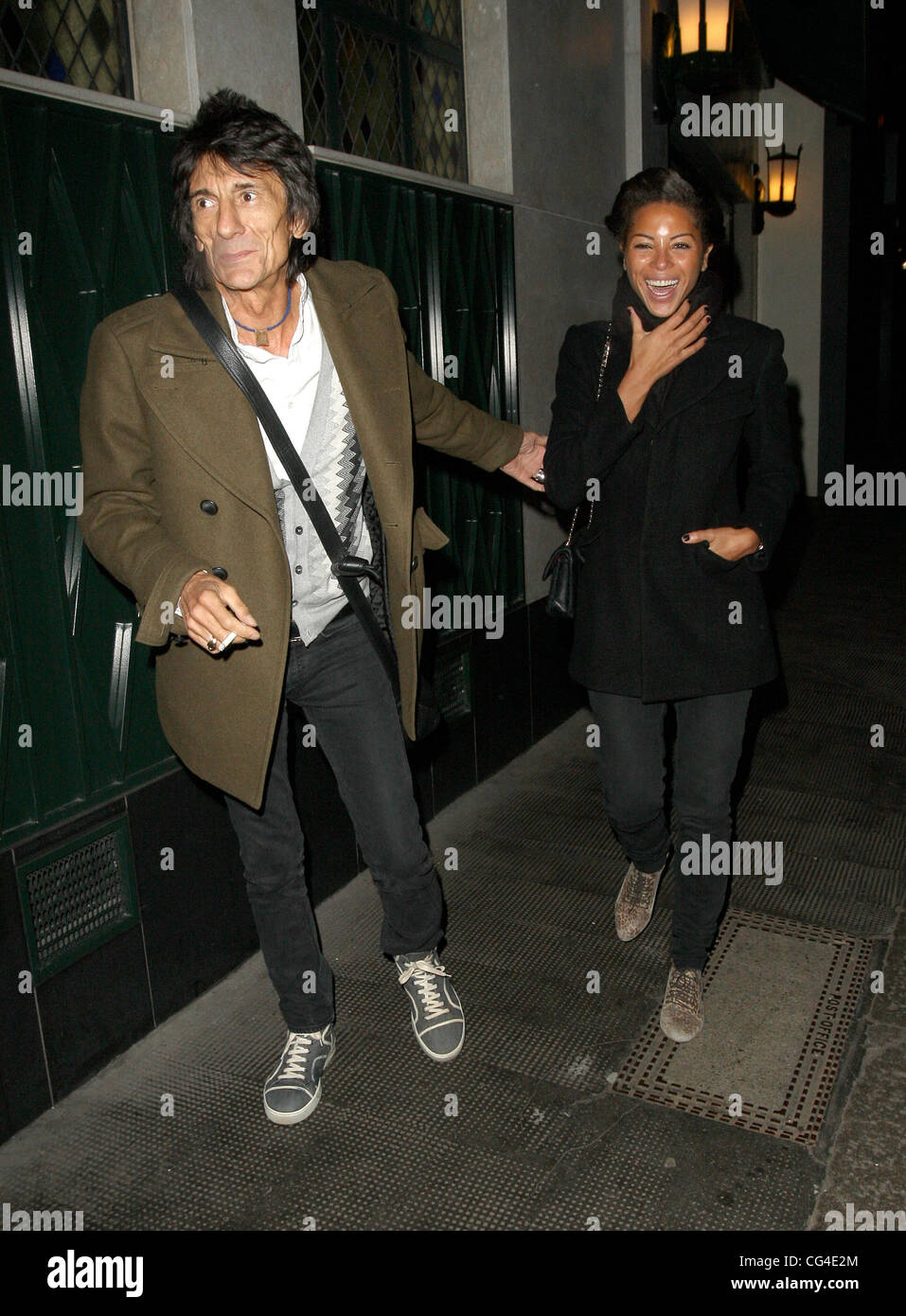 Ronnie Wood and Ana Araujo leave the Ivy Club. London, England 01.02.