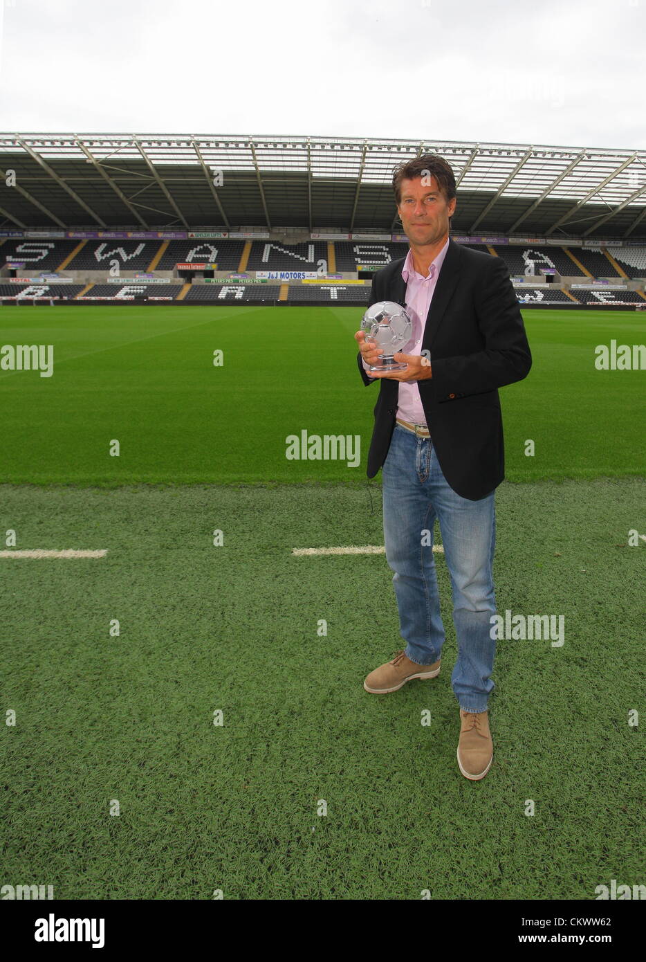 Pictured: Swansea manager Michael Laudrup with the F&C Investments League Managers Association  (LMA)performance of the week award for his team's performance against Queens Park Rangers. Thursday 23 August 2012  Re: Barclay's Premier League side Swansea City FC press conference at the Liberty Stadium, south Wales, UK. Stock Photo