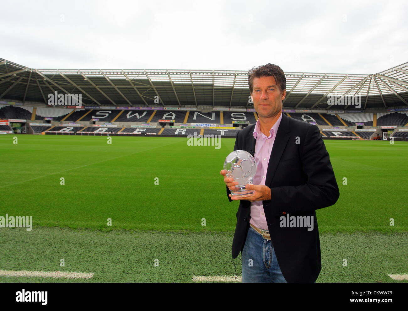 Pictured: Swansea manager Michael Laudrup with the F&C Investments League Managers Association  (LMA)performance of the week award for his team's performance against Queens Park Rangers. Thursday 23 August 2012  Re: Barclay's Premier League side Swansea City FC press conference at the Liberty Stadium, south Wales, UK. Stock Photo