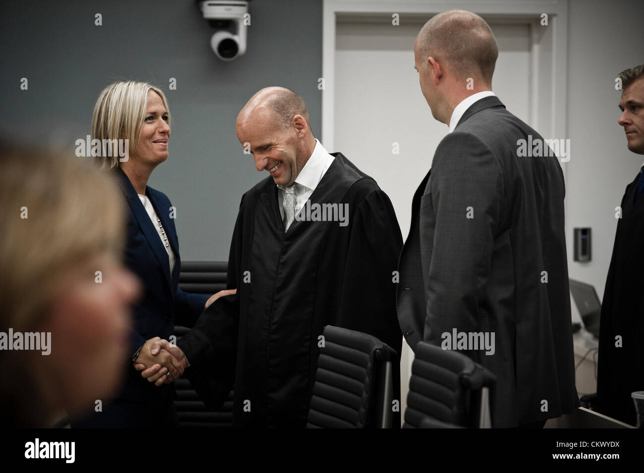 August 24, 2012 - Oslo, Norway: Key people in the Anders Behring Breivik trial appears in court on the day of the verdict. Lawyer Geir Lippestad who represent Breivik shake hands with prosecutor Inga Bejer Engh Stock Photo