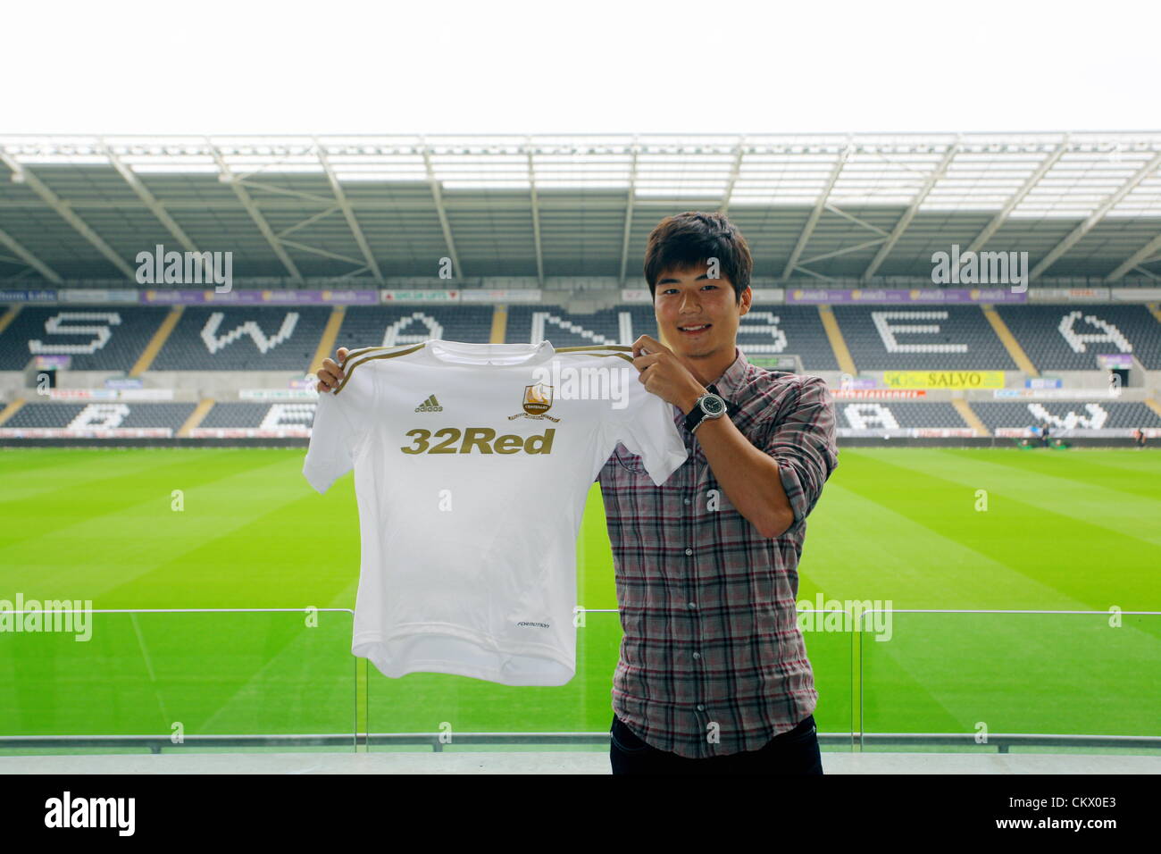 24th Aug 2012. Pictured: New Swansea signing, Ki Sung-Yeung at the Liberty Stadium, south Wales. Midfielder Ki Sung-Yeung has completed his almost £6million move to Swansea City FC from Celtic. Credit:  D Legakis / Alamy Live News Stock Photo