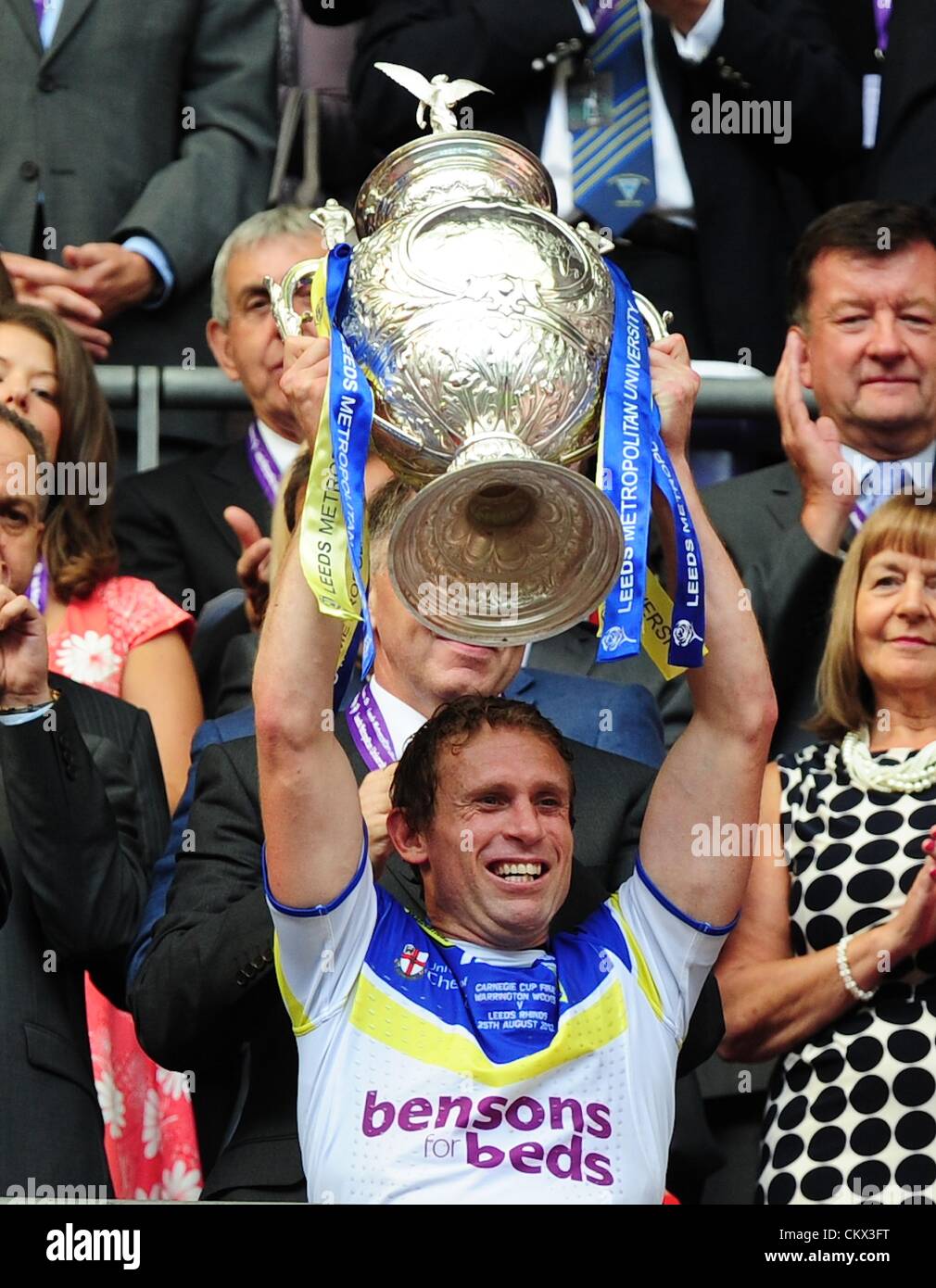 17.05.2012 London, England. Man of the Match Brett Hodgson holds the trophy aloft  in during the First Test between England and West Indies from Lords. Warrington won the final by a score of 35-18 over Leeds. Stock Photo