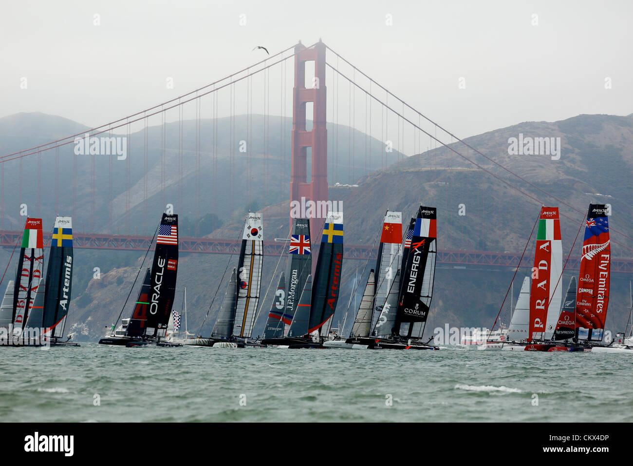 Aug. 25, 2012 - San Francisco, California, U.S - America's Cup World Series, San Francisco, CA August 25, 2012.  Last Fleet  Heat on day 4 at the Starting line with  the Golden Gate Bridge in the background.  ORACLE TEAM USA SPITHILL (Jimmy Spithill) wins the race  (Credit Image: © Dinno Kovic/ZUMAPRESS.com) Stock Photo